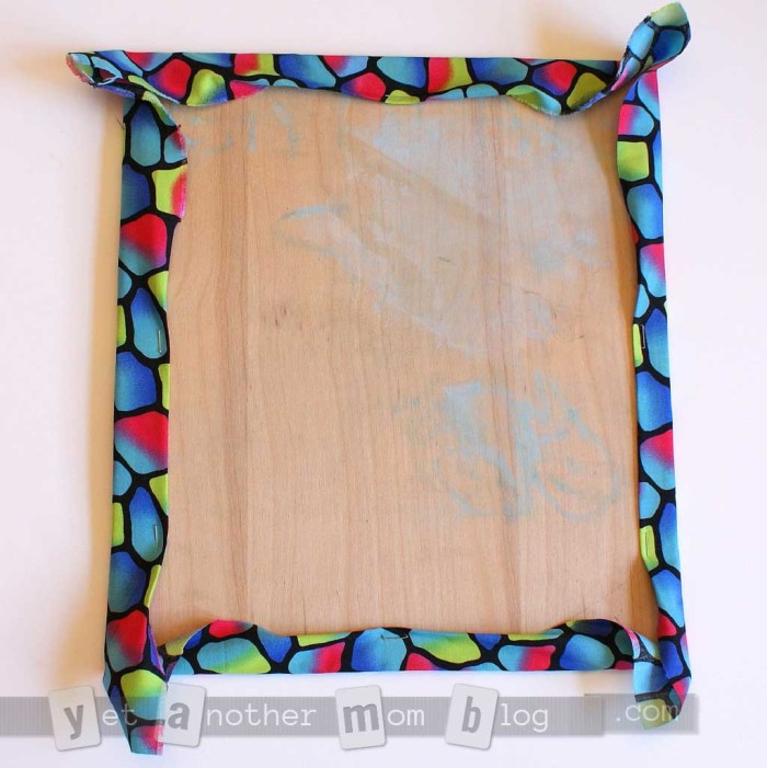 string art - stapling on fabric background