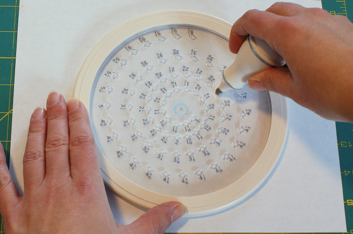 inserting blade into circle cutter