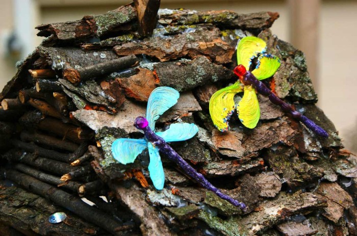 Dragonflies on the fairy house roof