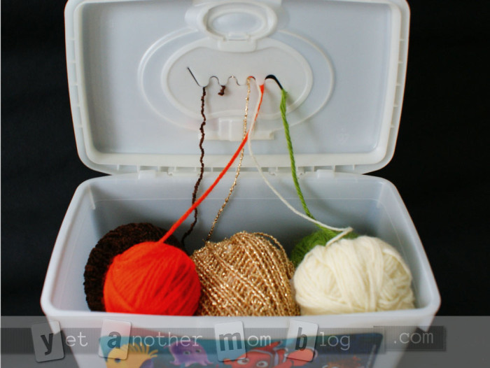 Baby wipes organizer for balls of yarn