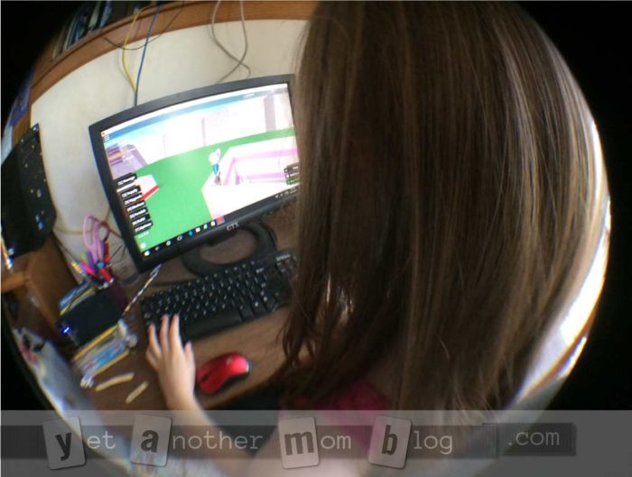 Fisheye lens of Em at desk